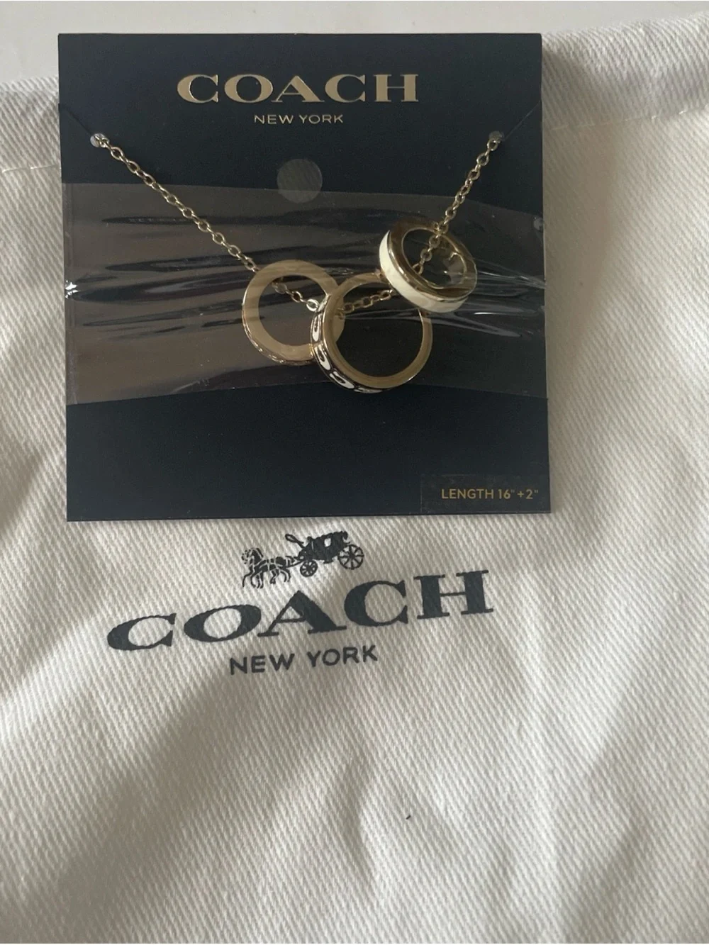 Coach Gold-Tone Necklace with White Enamel and Crystal-Accented Rings